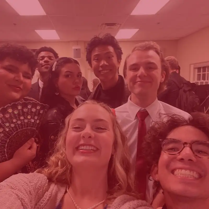 Group of students take selfie at a music composition recital