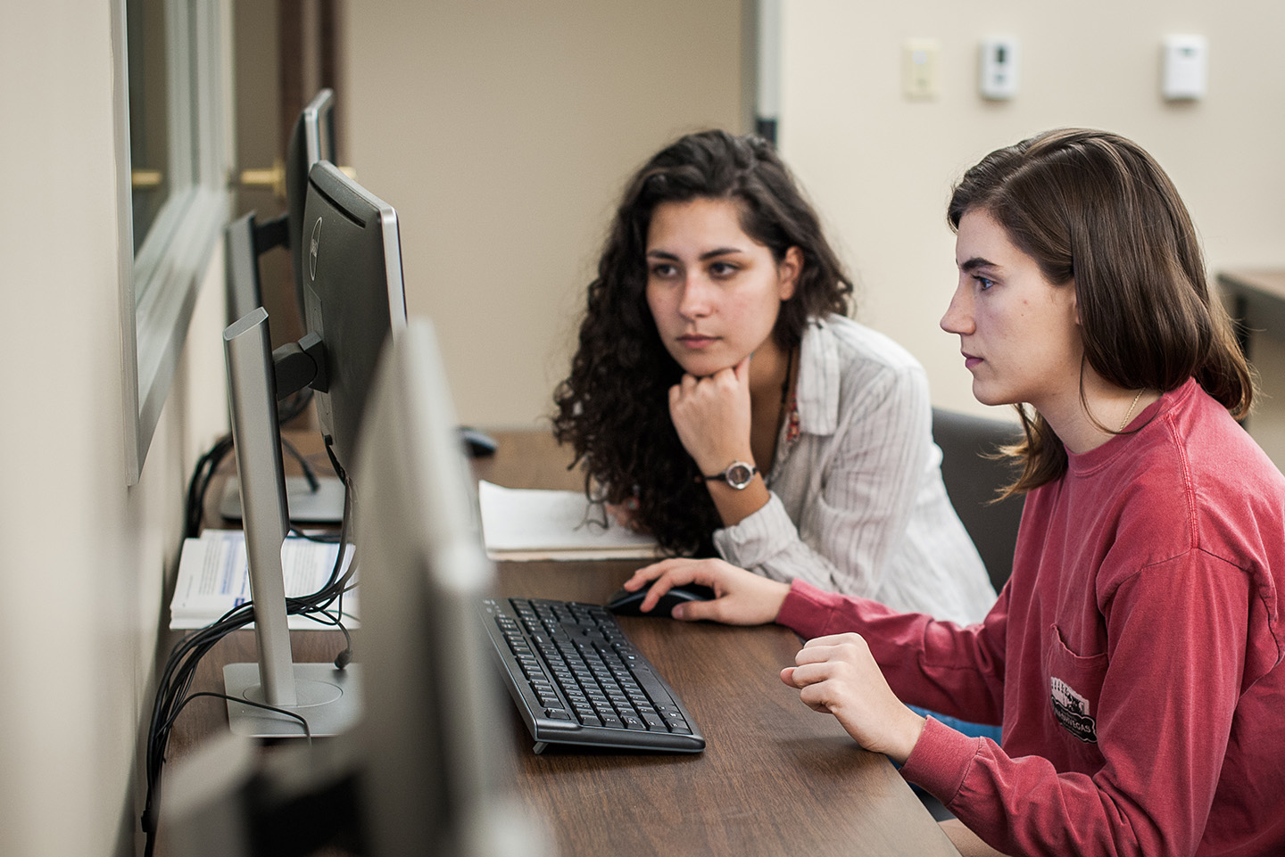 Two female students working at a computer