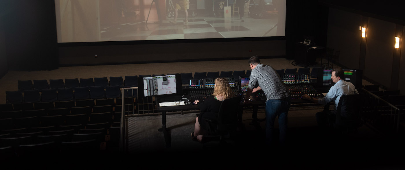 students and faculty in the Johnson Large theater at the mixing station