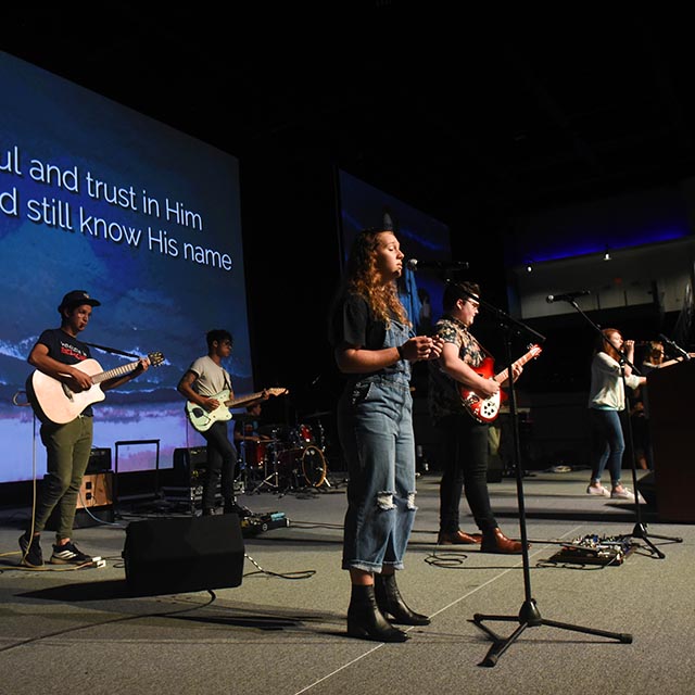 Students leading church worship with music