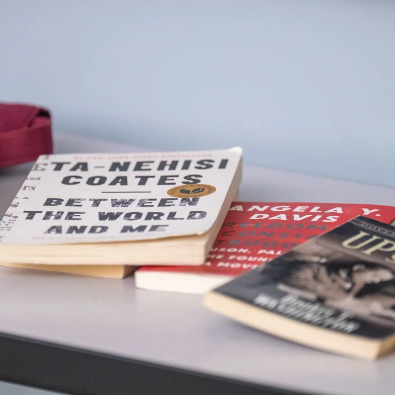 stack of books spread on a table