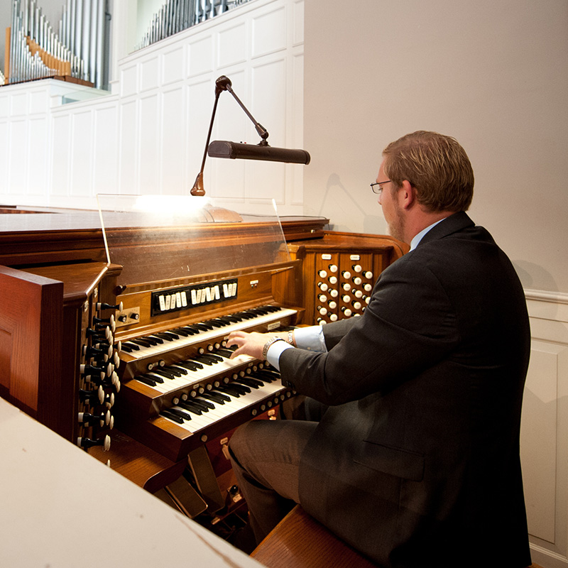 Organ player playing on organ