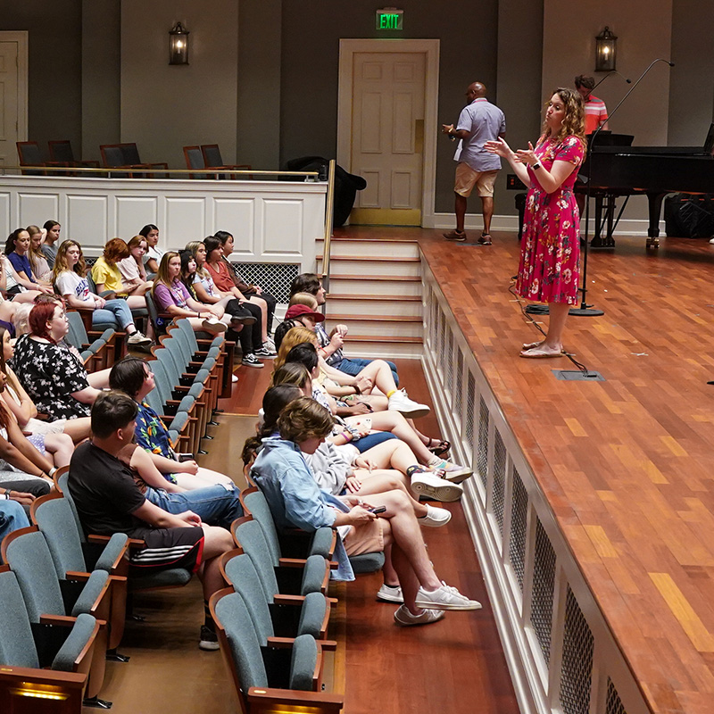 Students listen to professor during class in McAfee Concert Hall