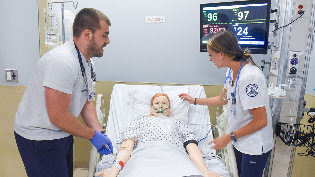 Nursing students working in a simulation