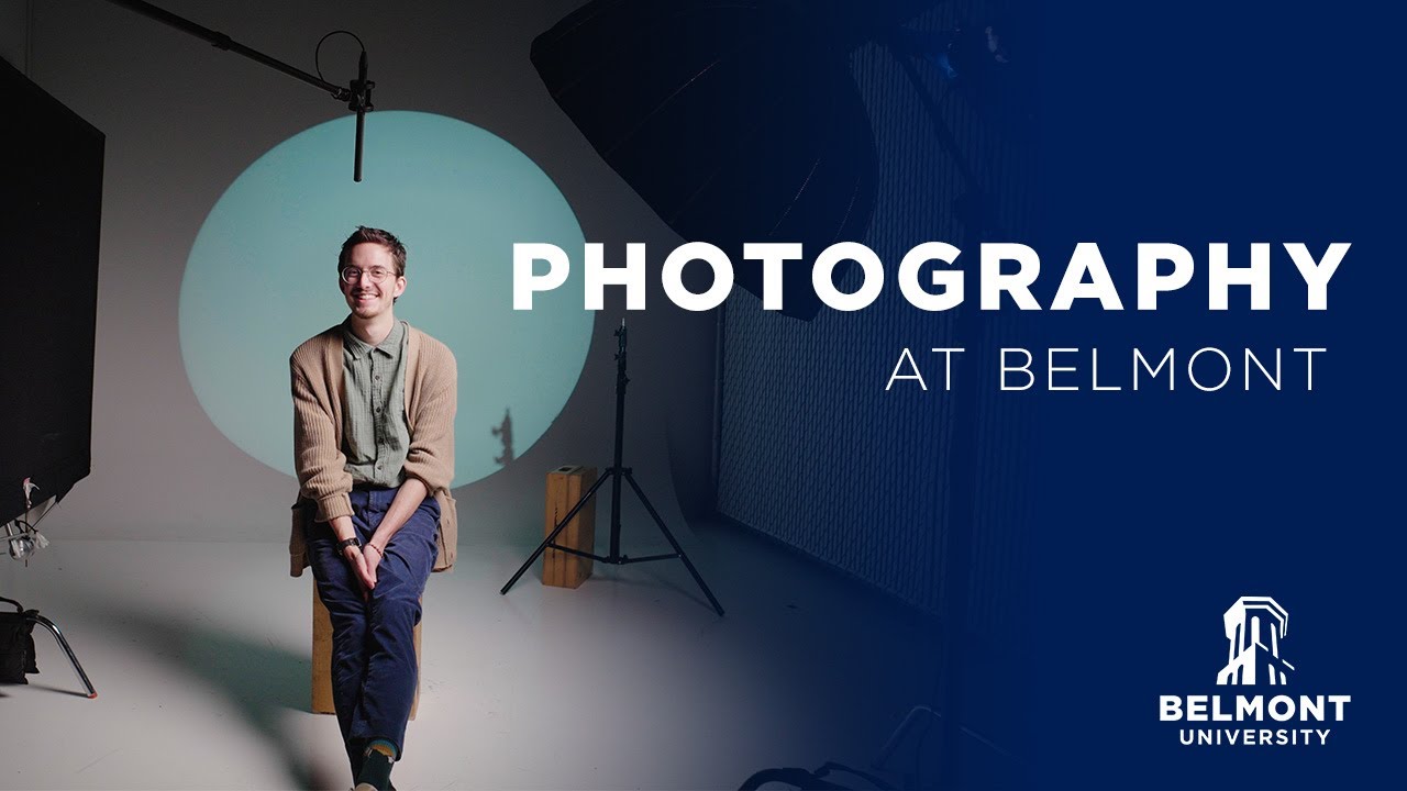 A student sitting in a photography studio smiles in front of a lighted background. Text on the image reads: "Photography at Belmont" with Belmont University branding.