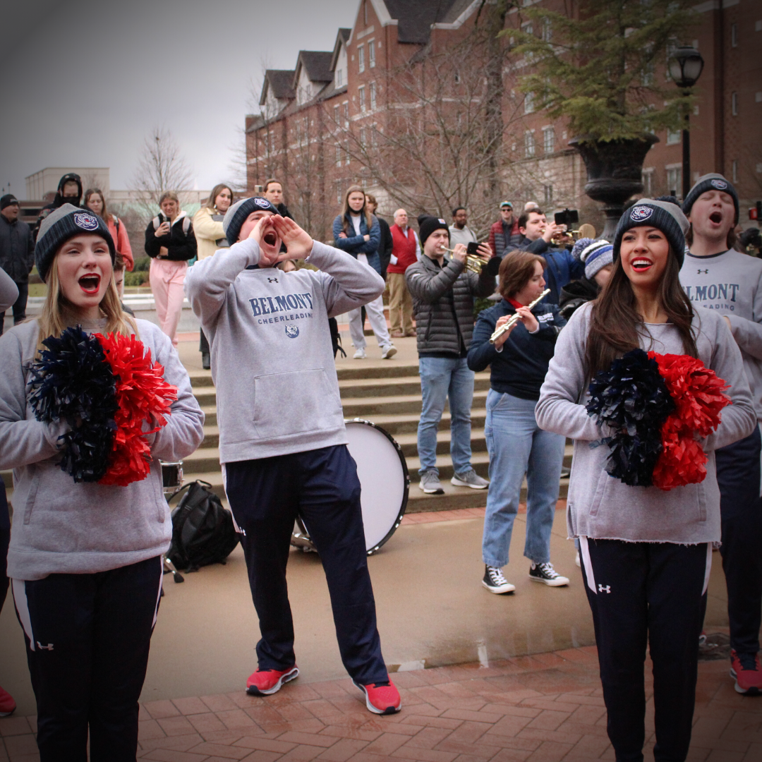 Belmont cheerleaders cheer outside during Homecoming Parade.