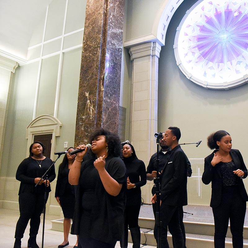A group of students singing in chapel during MLK worship service