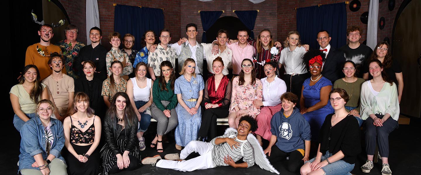 Theatre students pose for picture on stage of local professional theatre