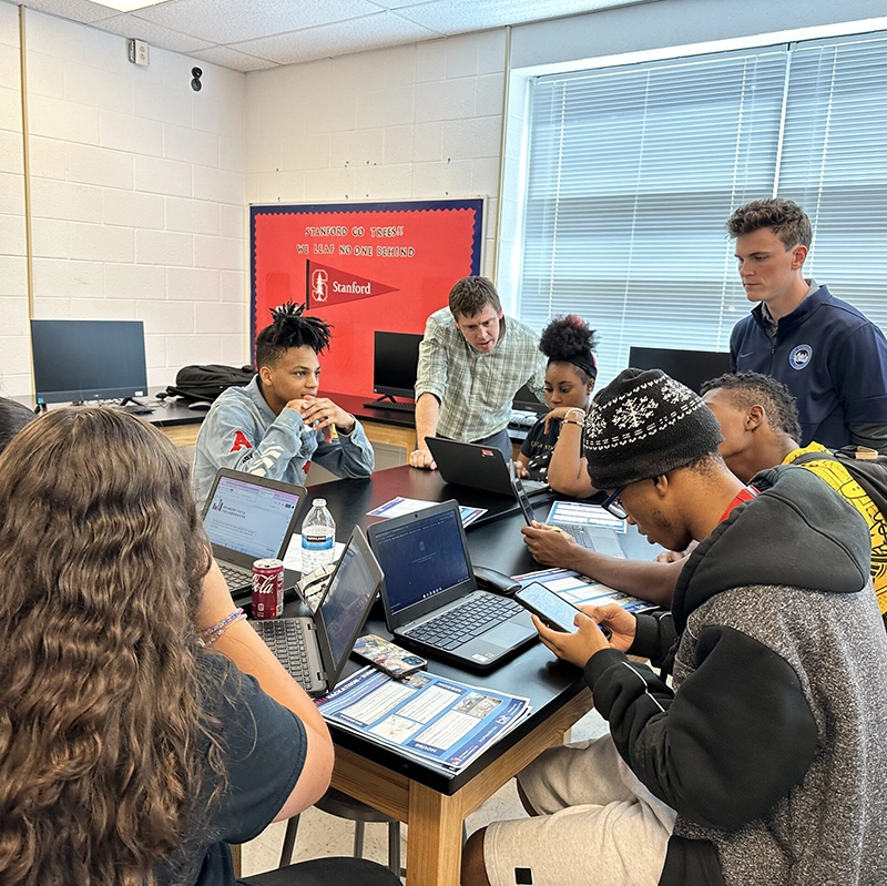 Students in a classroom working on laptops