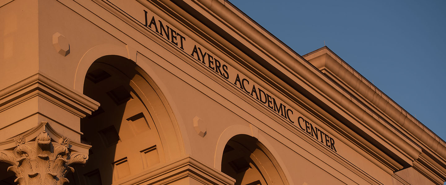 The front of the Ayers Academic Center at sunrise