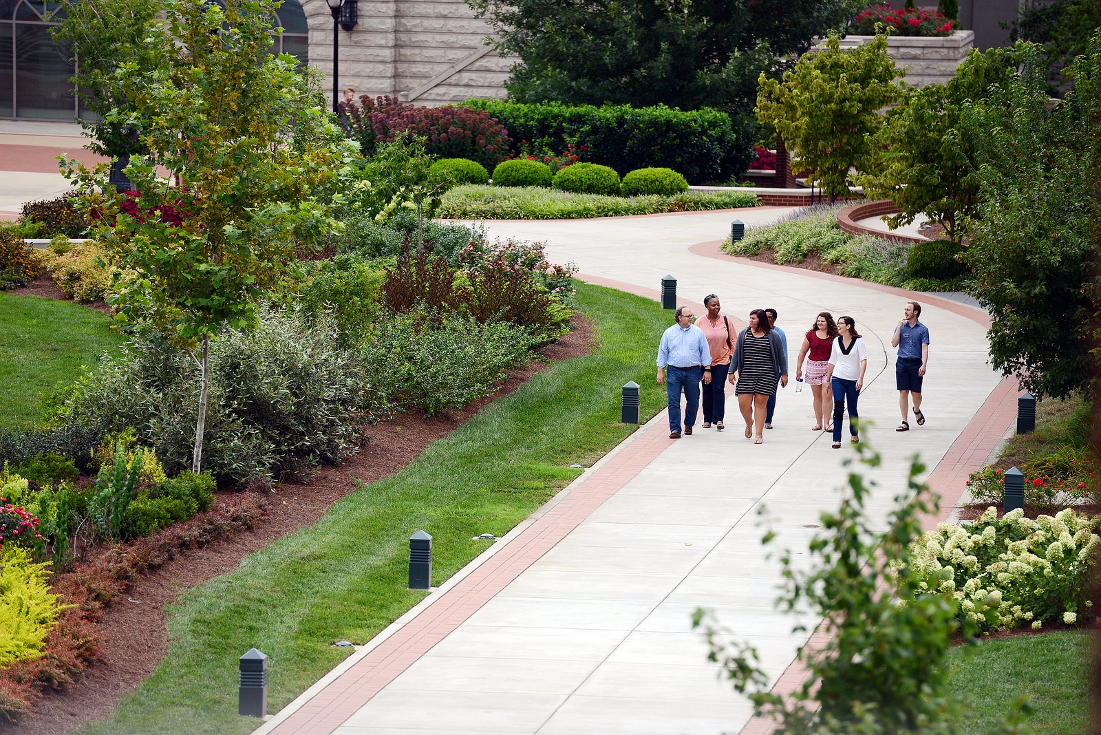 A student walking to class on the historic side of campus