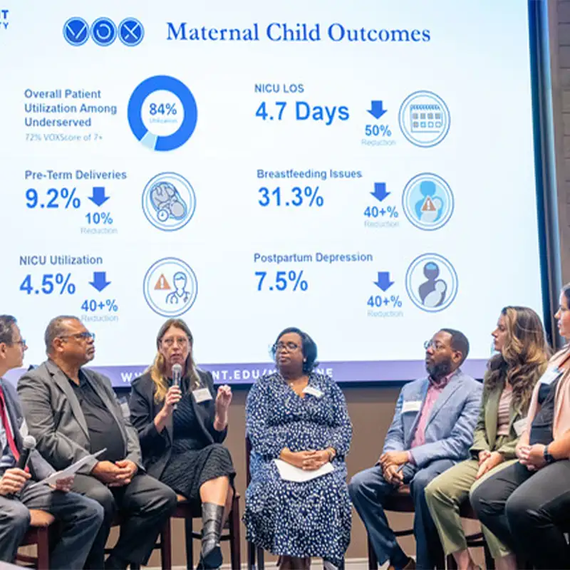 Experts discussing maternal child health statistics, including NICU utilization and breastfeeding issues, at the Symposium