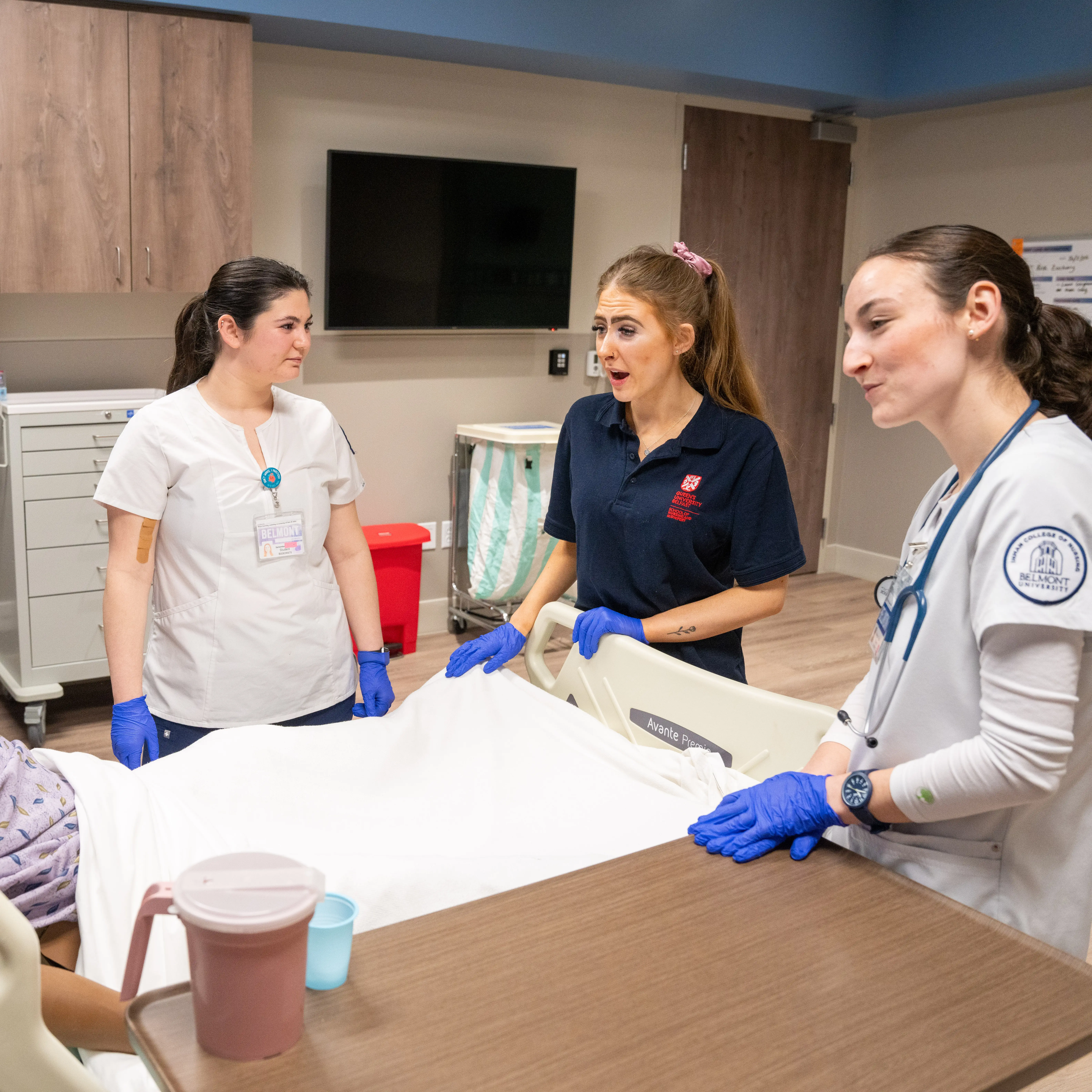Nursing students practice patient care skills using a high-fidelity simulation mannequin in Belmont University’s clinical simulation lab.