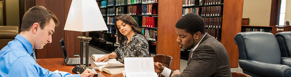 Students studying in the College of Law Library