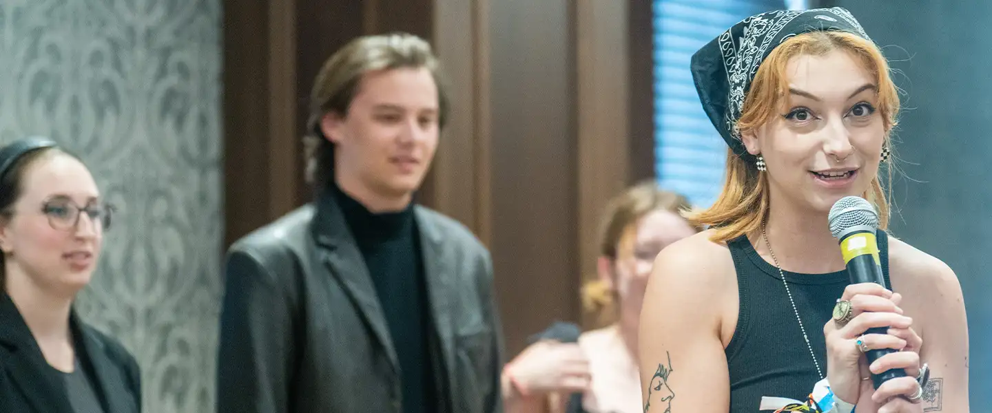 A student in the audience of a past humanities symposium