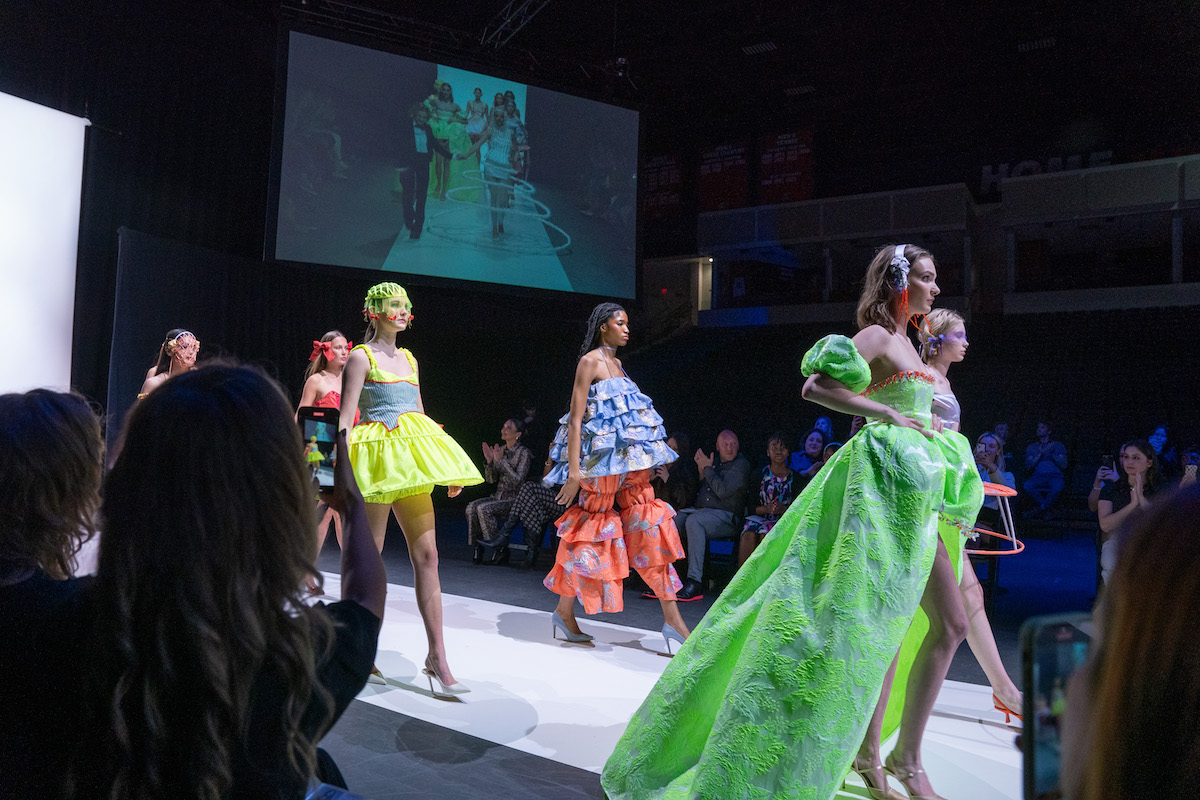 Fashion models walking down the runway in clothes designed by O'More college students