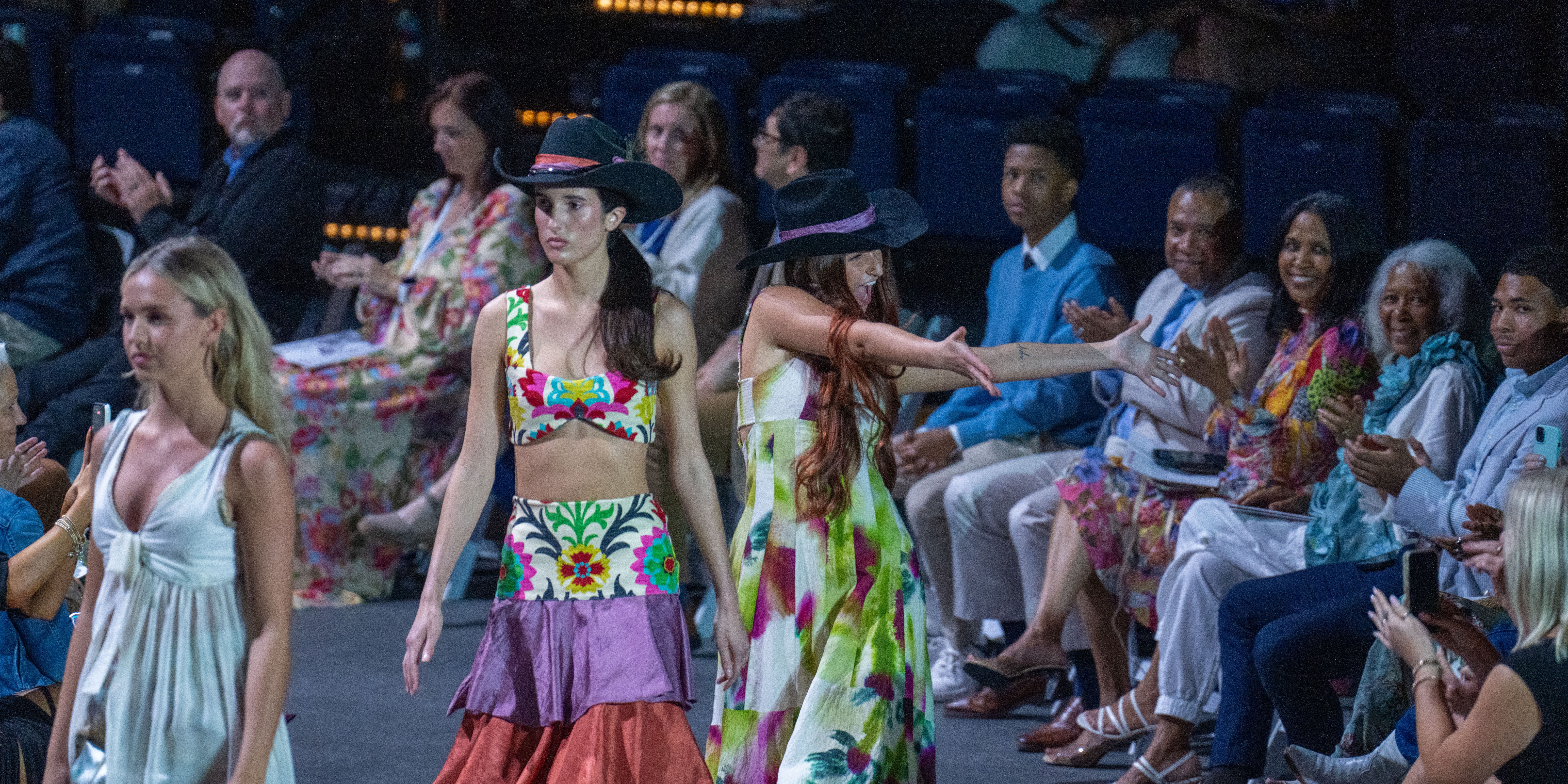 Fashion Design student walking child models down the runway