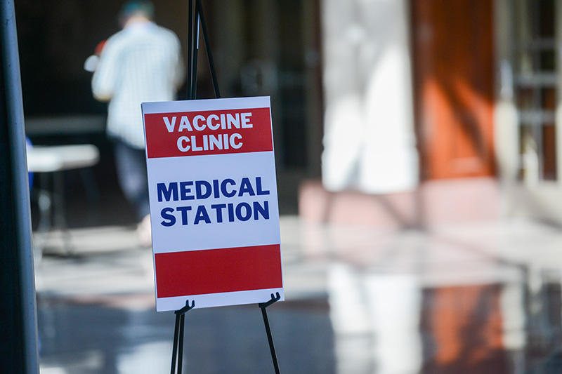A sign refrencing a nearby vaccine station