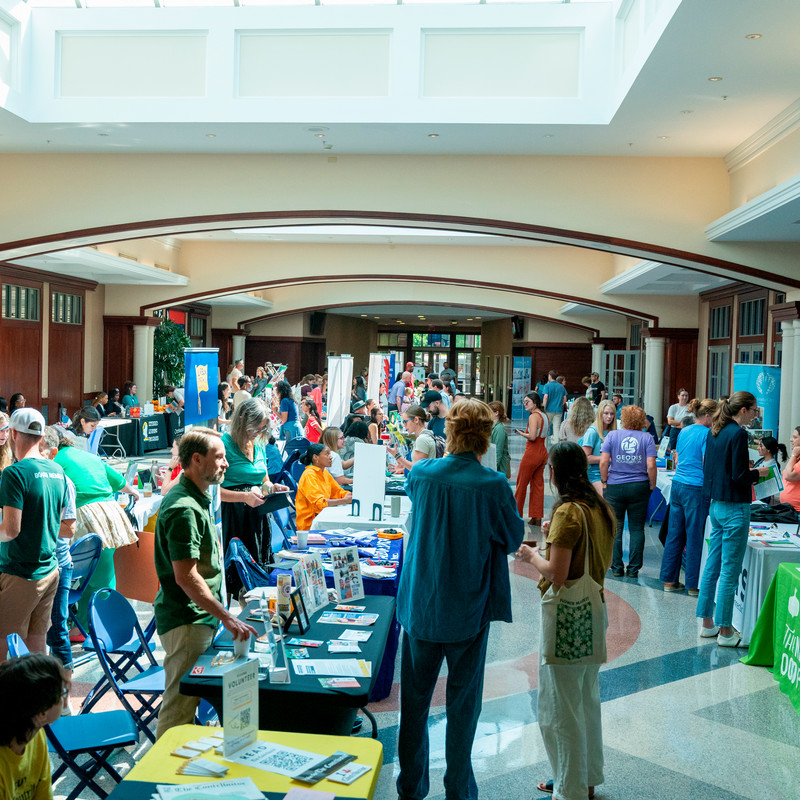 wide image of tables and representatives participating in the fair