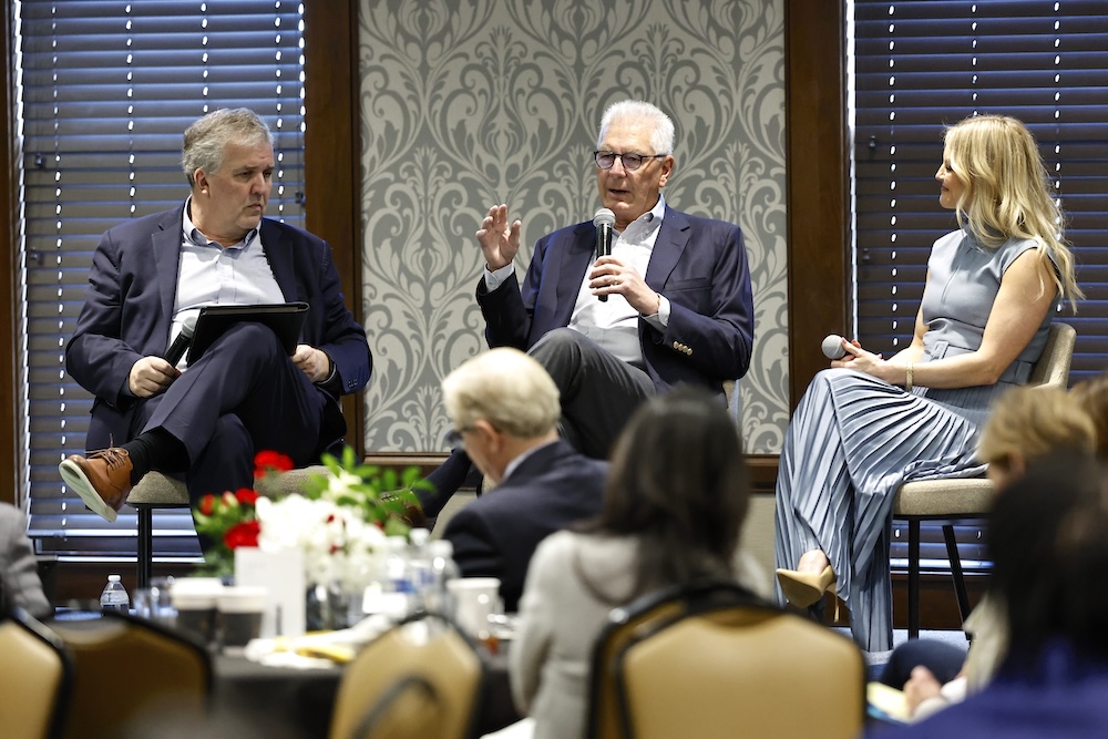 Greg Jones, Milton Johnson, and Dean Brittany Schaffer speak on stage at the LearningWell Conference