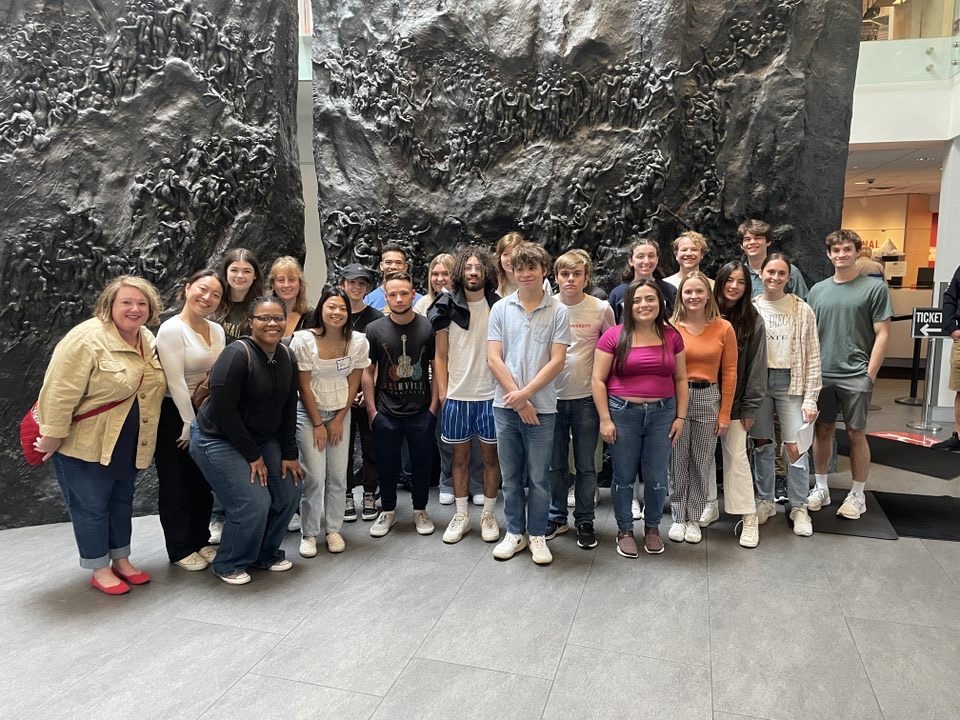 Memphis Plunge group take a group picture in the National Civil Right Museum lobby