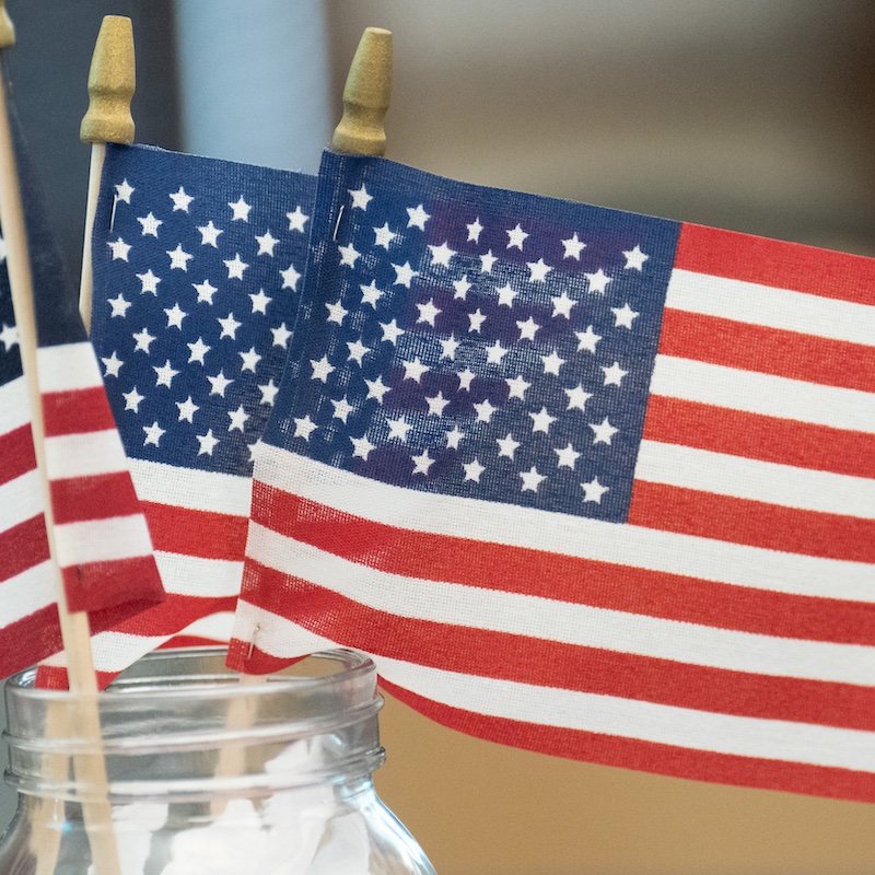 American flag on a table in a vase