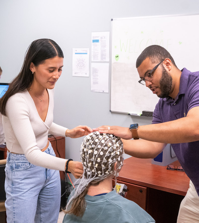 student and faculty use EEG cap