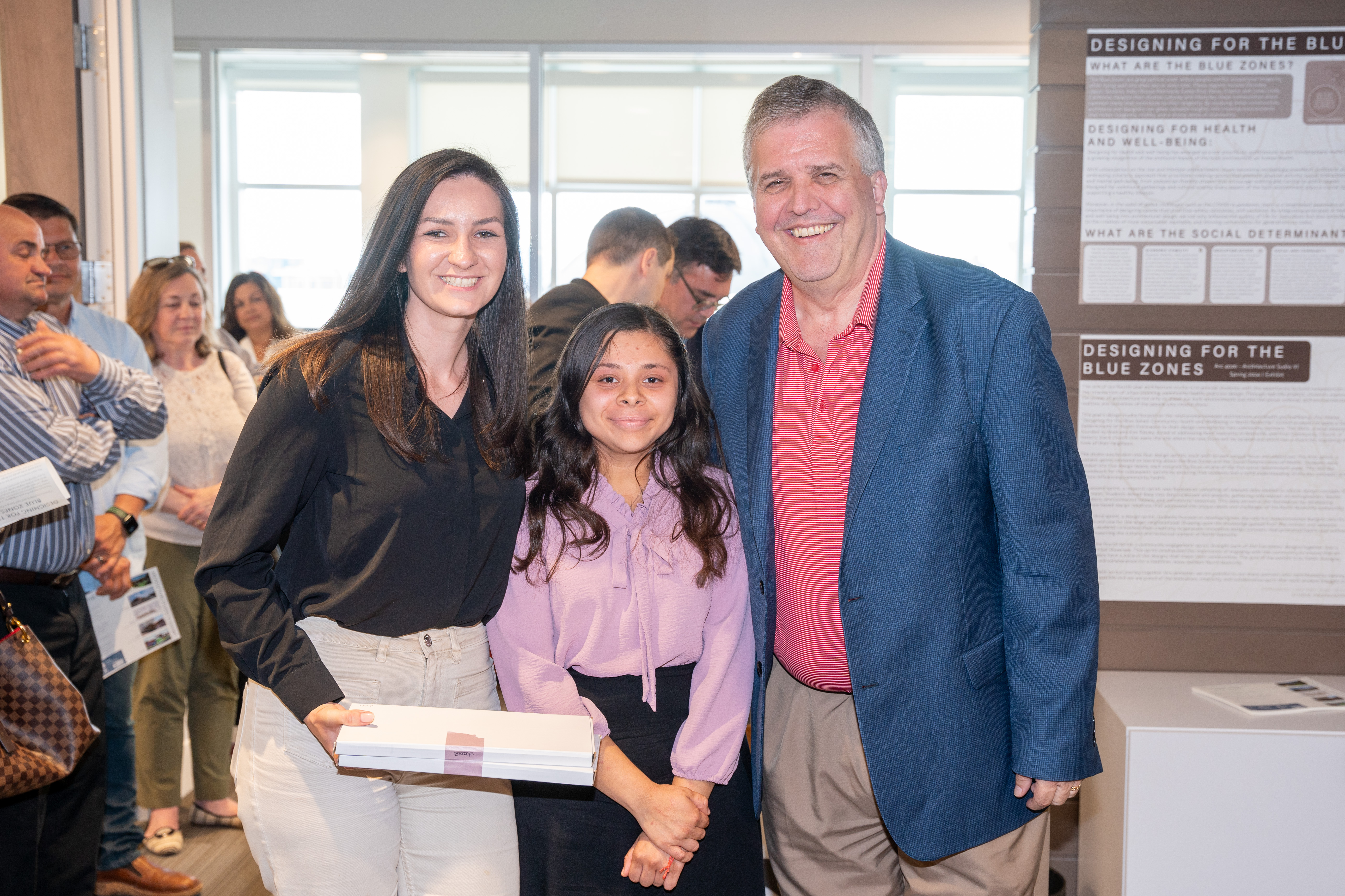 Design team pictured with University President Dr. Greg Jones