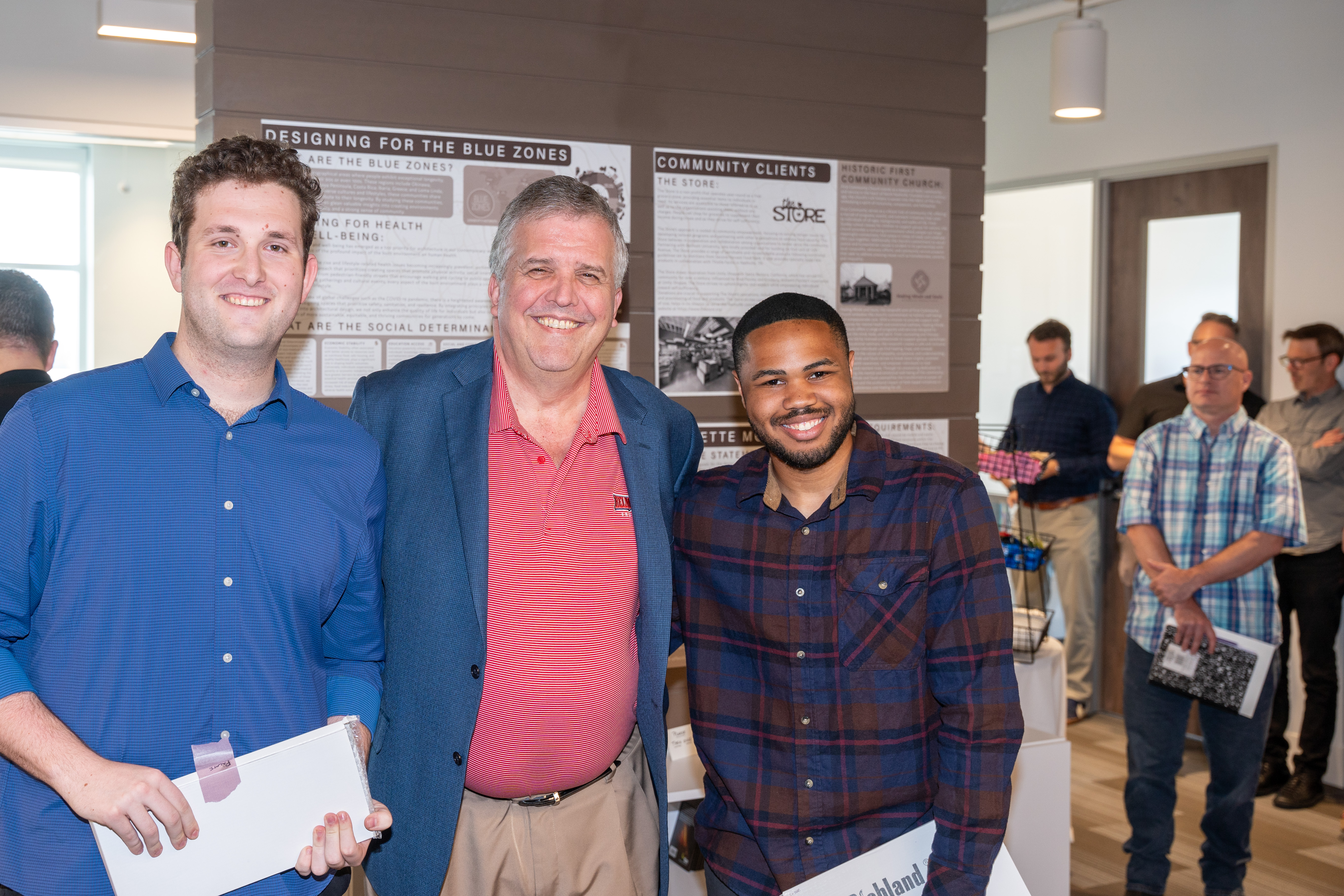 Design team pictured with University President Dr. Greg Jones