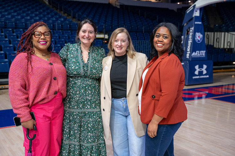 Group photo of four Belmont employees