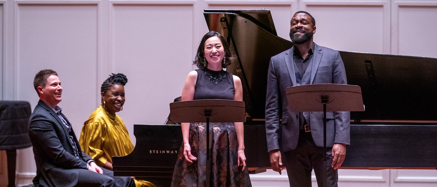 performers of Songs of Hope smile after a song