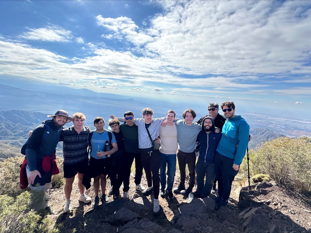 Belmont group pose on top of mountain in Mendoza, Argentina