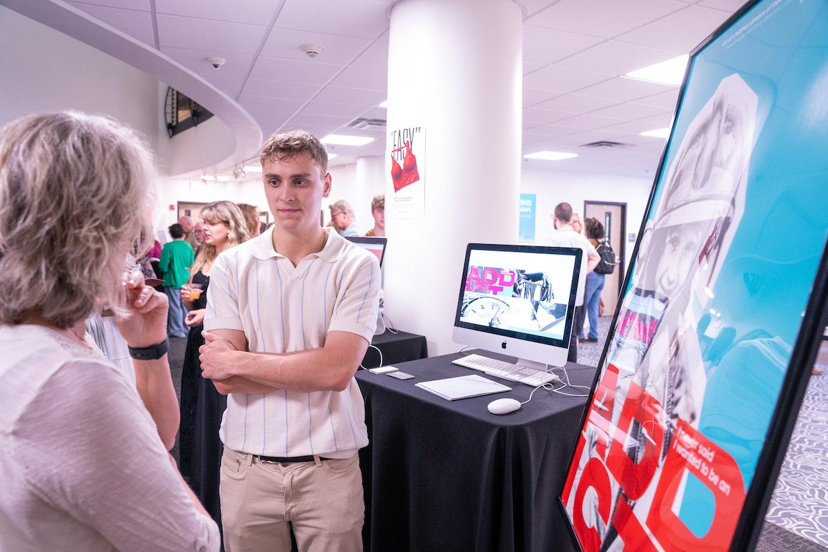 bazzoni talks with attendees about his addiction campaign