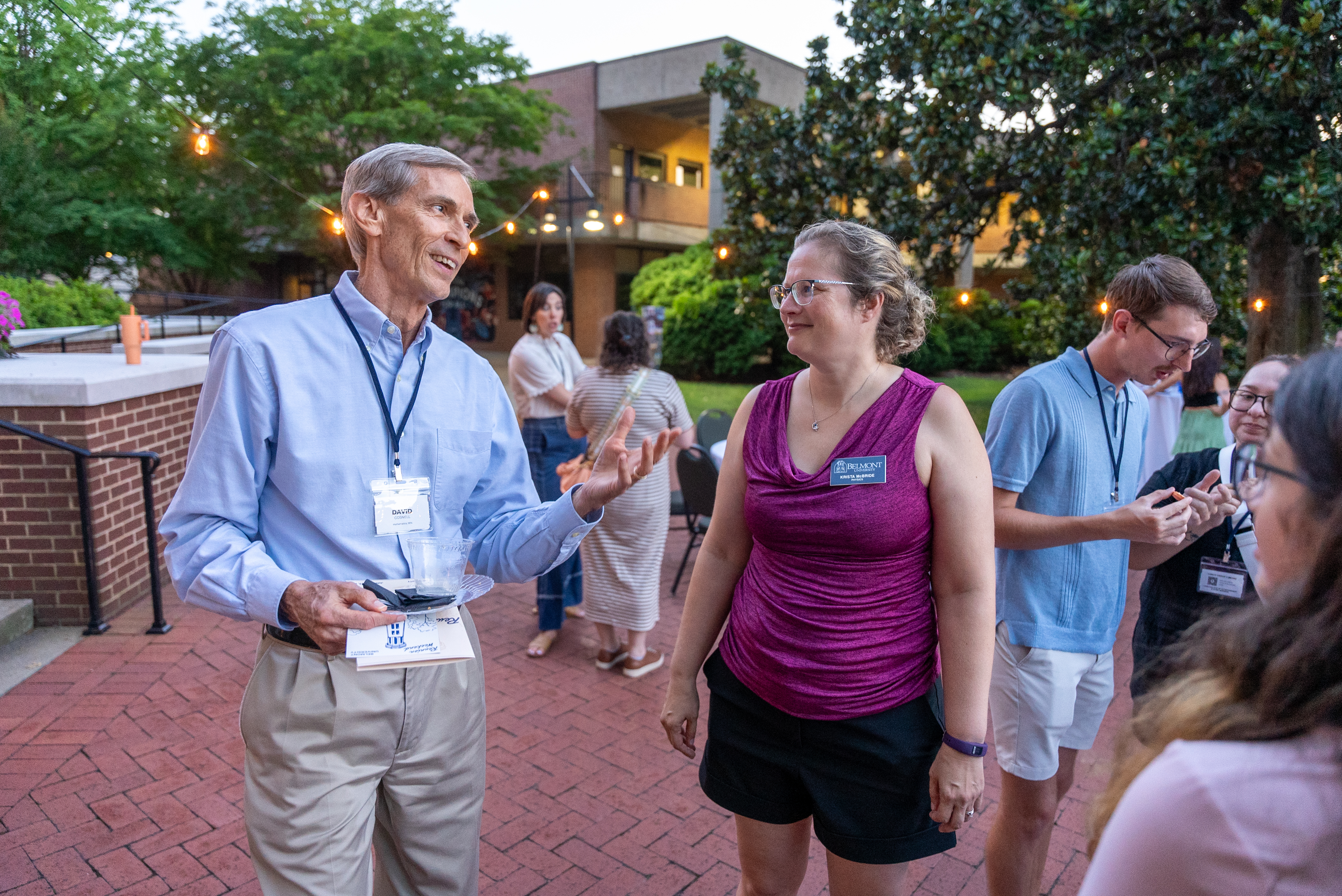 Man and woman talking at dessert reception