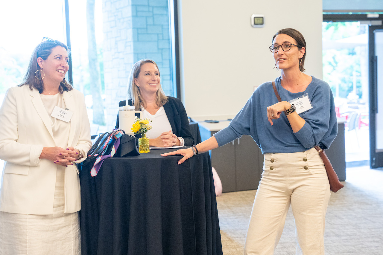 Three female attendees of the SCOPE reunion