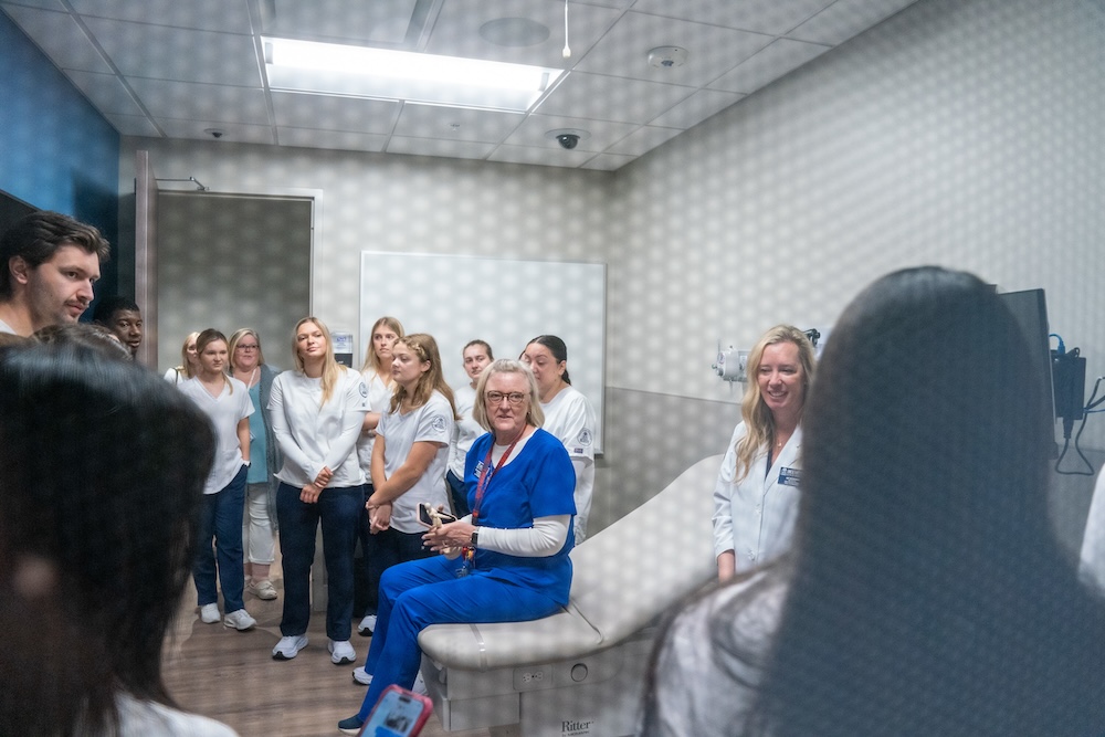 Students and faculty in an exam room