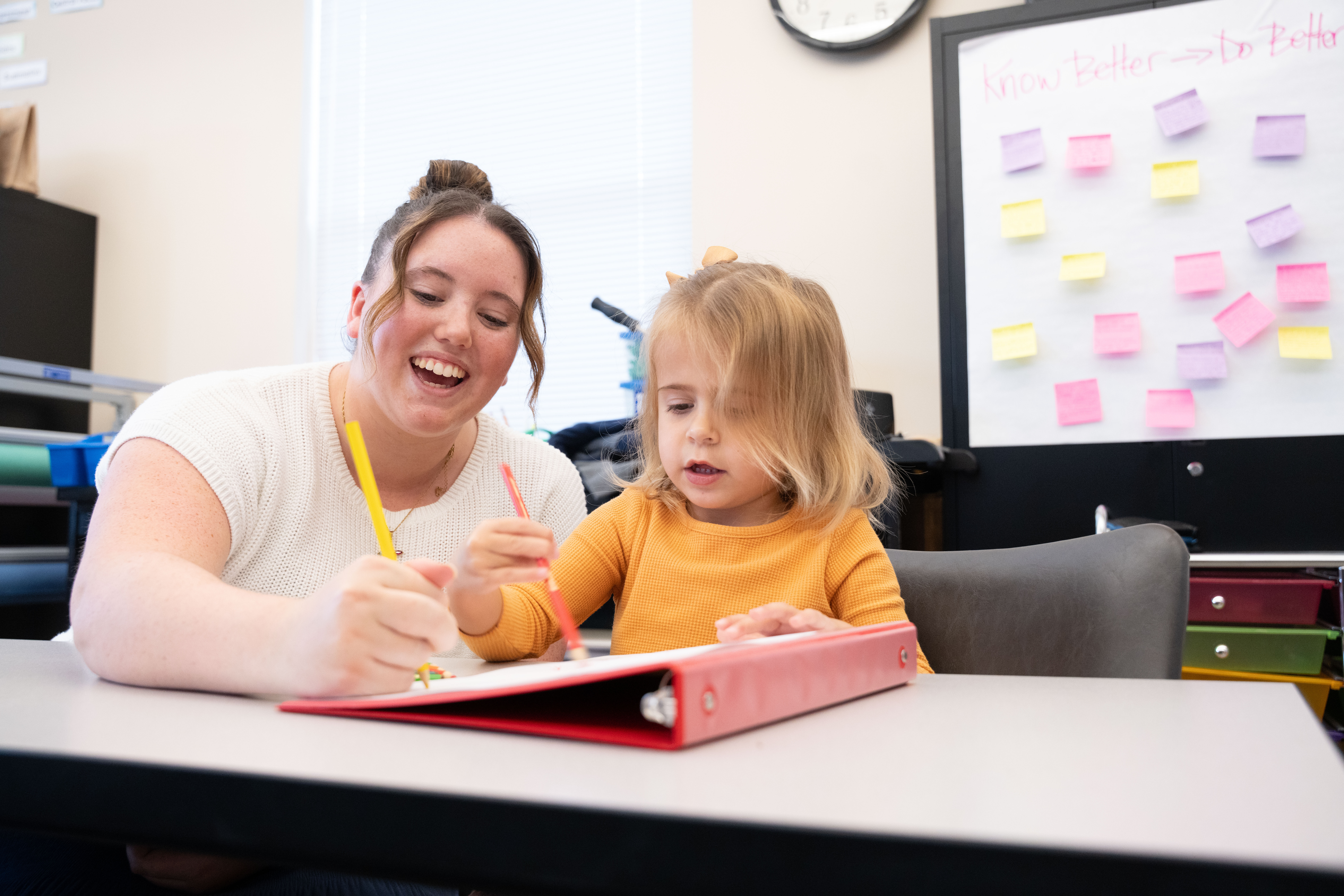 Teacher helping a child