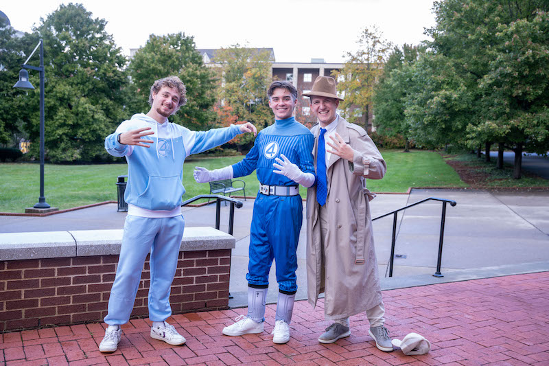 Three students dress as Fantastic 4 characters