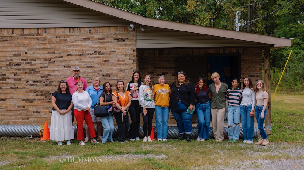 students on a site visit to the duck pond facility