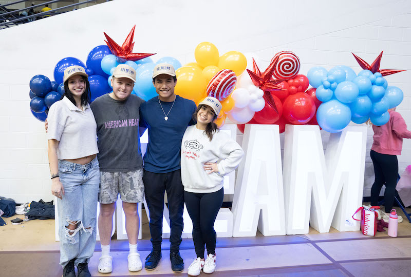 Students posing next to DREAM sign