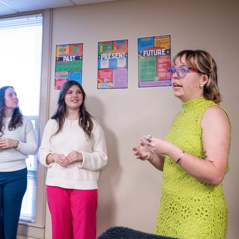 student presents her posters