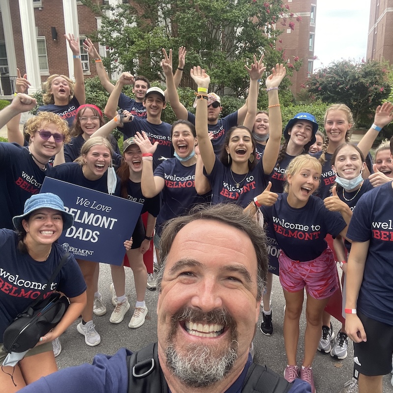 Sam takes a selfie with students at move in
