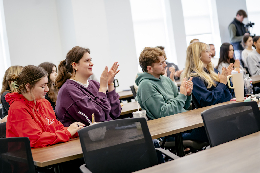 Students clapping at pitch competition