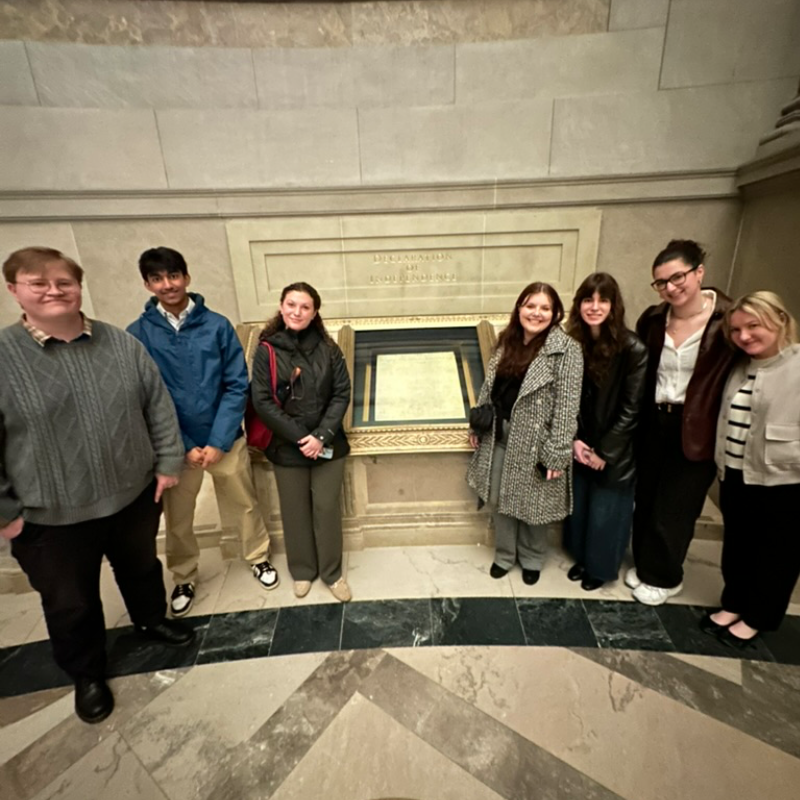 Group of students viewing the Declaration of Independence at the National Archives Museum.
