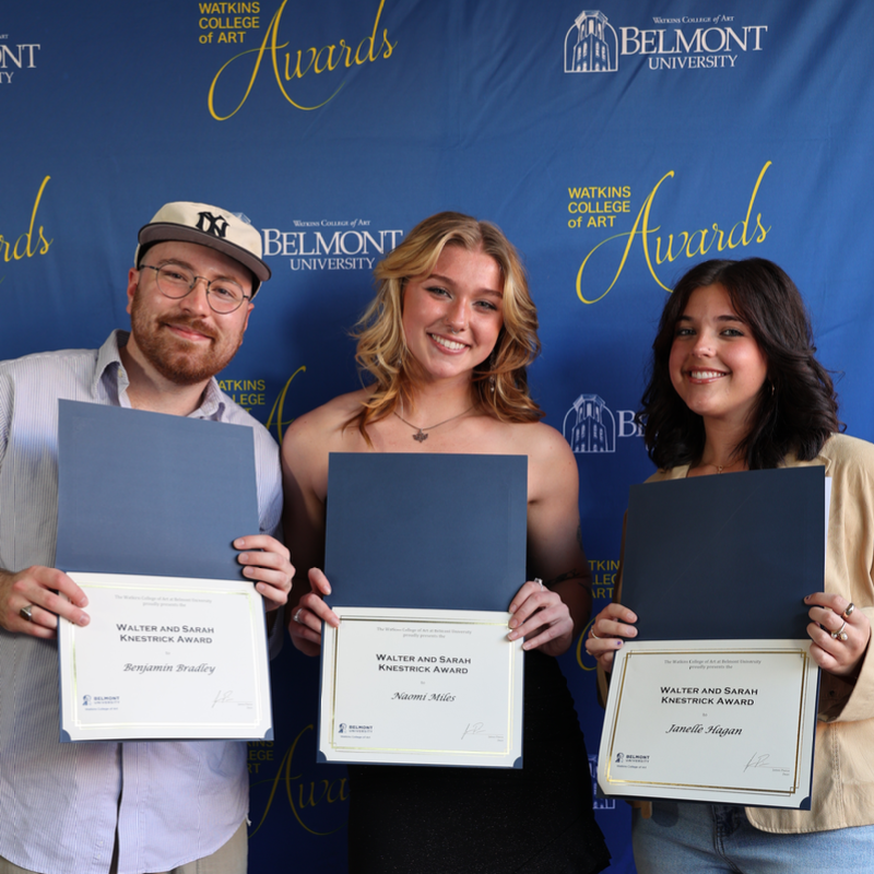 Three smiling students holding Walter and Sarah Knestrick Awards from Watkins College of Art, Belmont University.