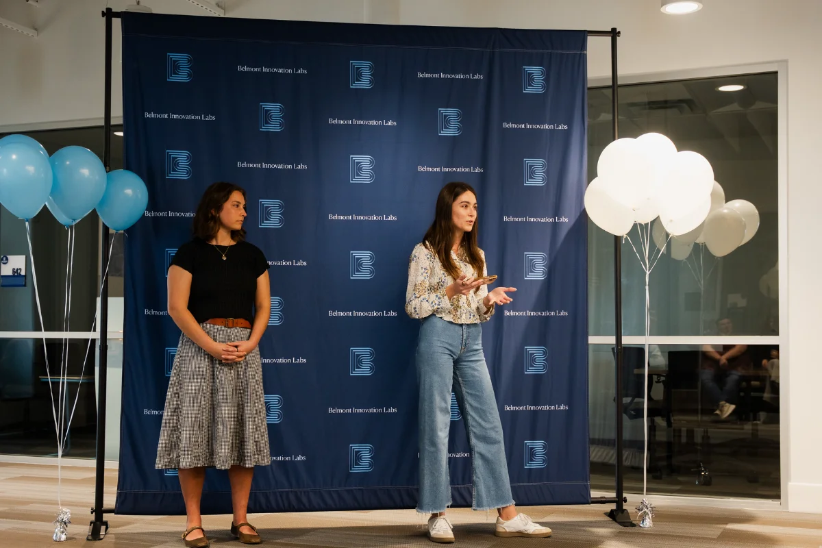 two students give remarks