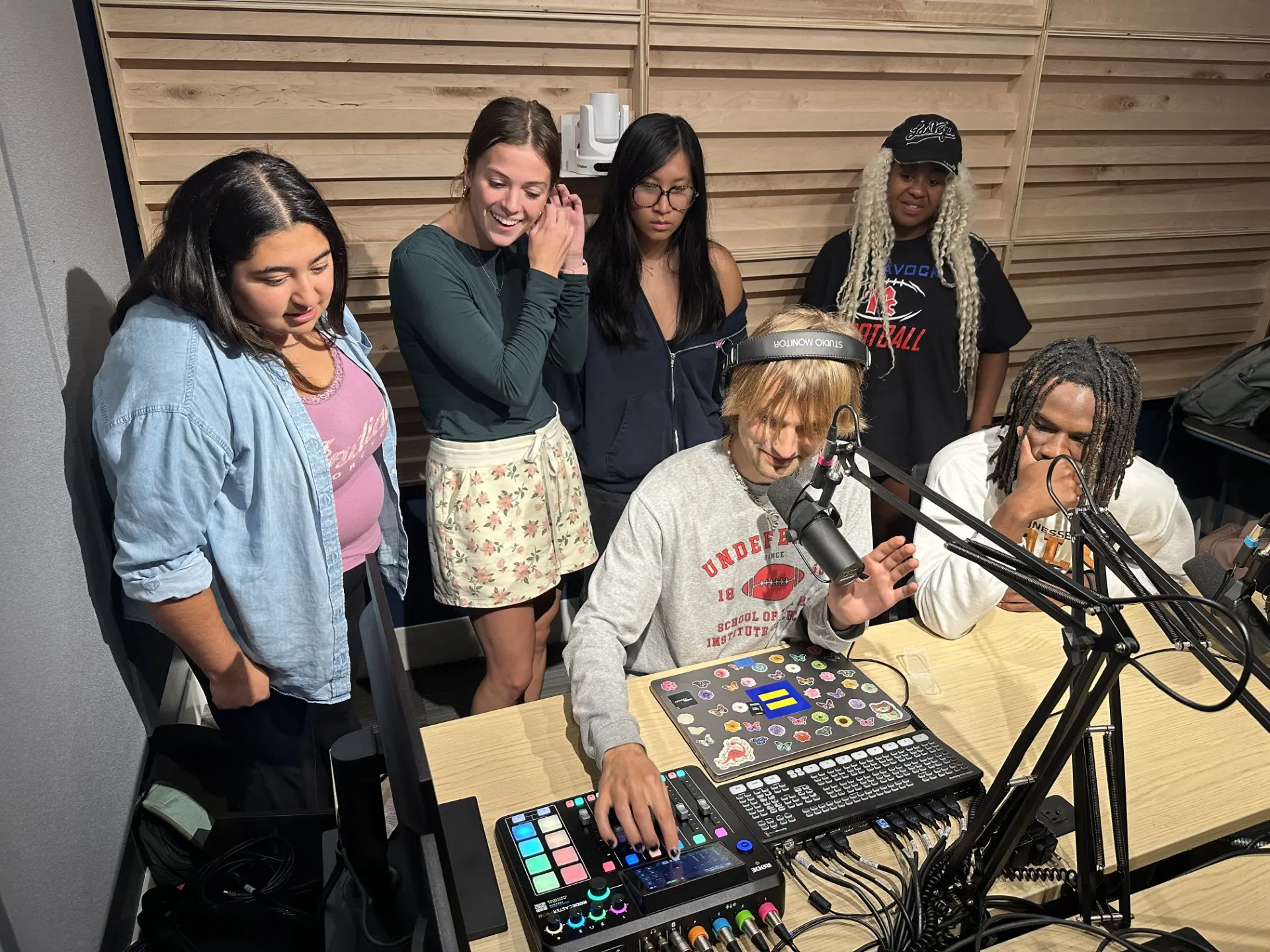 Noah Kammer recording music in studio with friends 