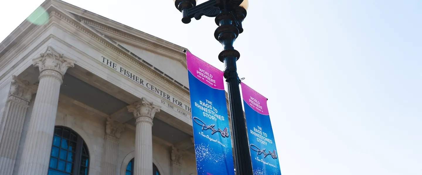 Fisher Center with Dolly Signs out Front