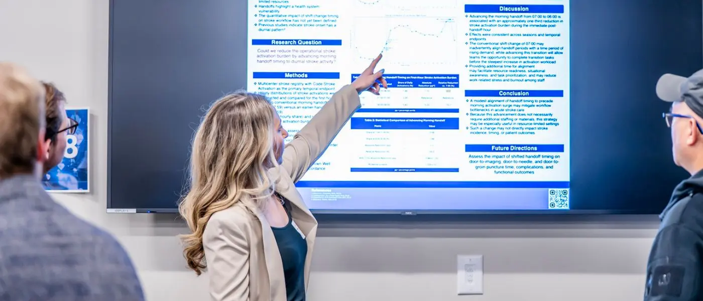 A student presents poster presentation at inaugural Global Medicine Symposium