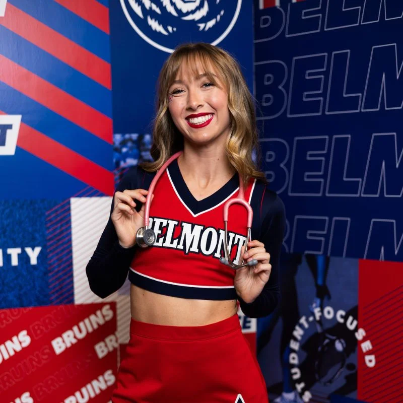 Mallory Newsome poses in cheer uniform 